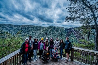 group of WVU Collegiate Recovery students at the new river gorge bridge in West Virginia