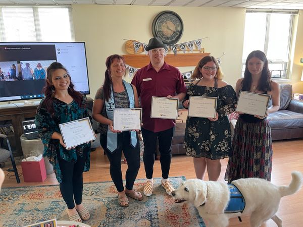 5 WVU Collegiate Recovery scholarship recipients hold certificates at graduation celebration