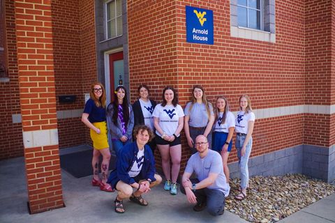 WVU Collegiate Recovery staff and students standing outside Serenity Place